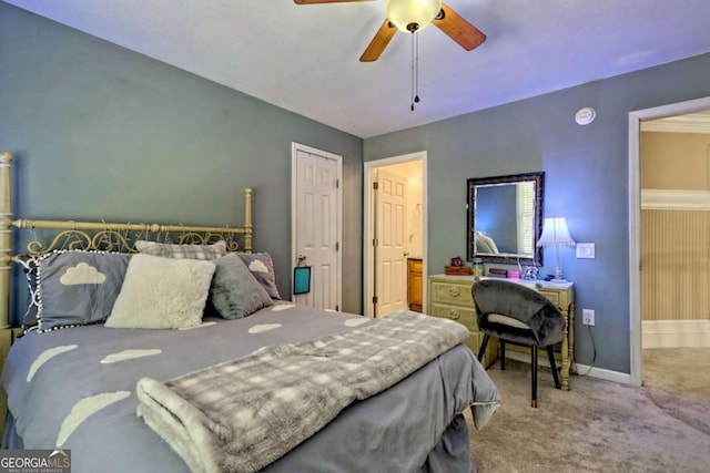 bedroom featuring baseboards, ceiling fan, and carpet flooring