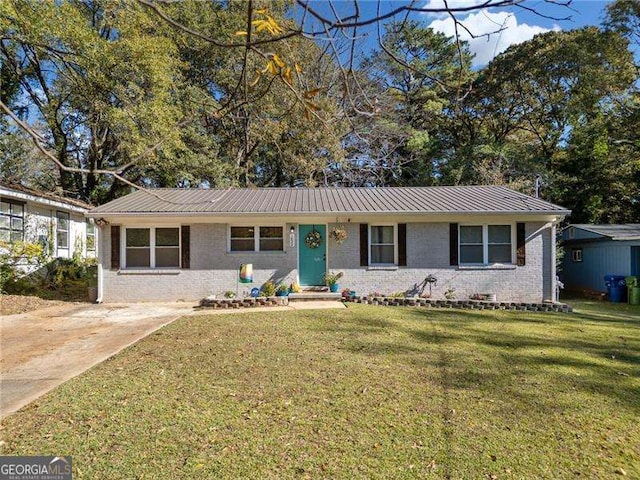 ranch-style home with brick siding and a front yard