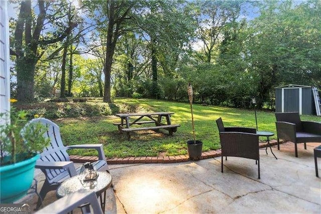 1824 Evans Dr SW, Atlanta, GA 30310 - view of patio with a storage unit and an outbuilding