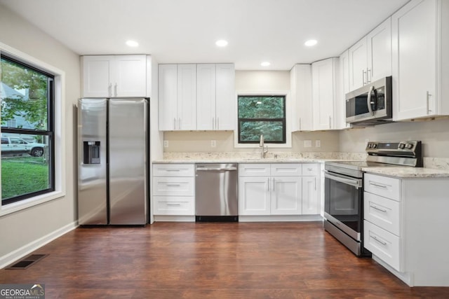 kitchen featuring visible vents, a healthy amount of sunlight, appliances with stainless steel finishes, and a sink