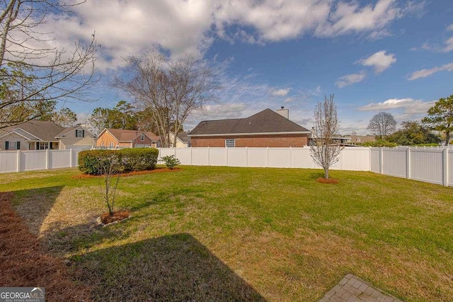 view of yard featuring a fenced backyard