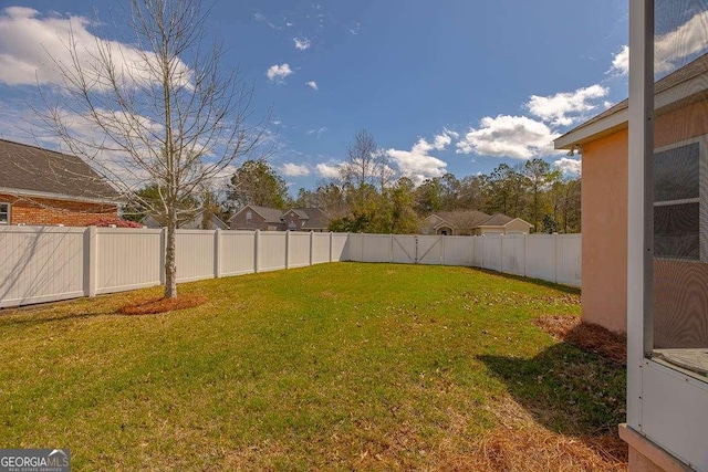 view of yard featuring a fenced backyard