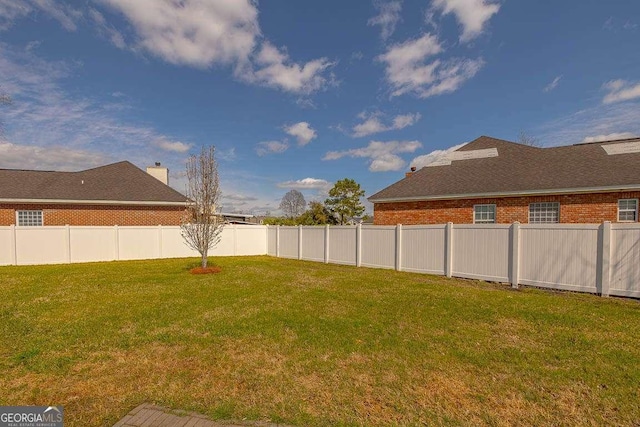 view of yard featuring a fenced backyard