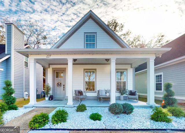 entrance to property with central air condition unit and covered porch