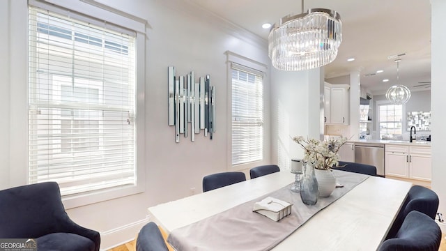 dining space featuring visible vents, baseboards, ornamental molding, recessed lighting, and an inviting chandelier