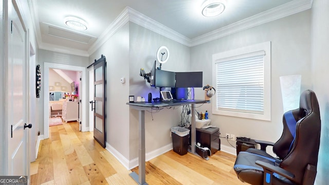 interior space with crown molding, attic access, wood finished floors, and baseboards