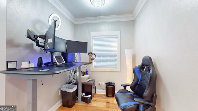 office space with crown molding, baseboards, and wood finished floors