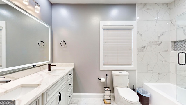 bathroom featuring marble finish floor, toilet, baseboards, and a sink