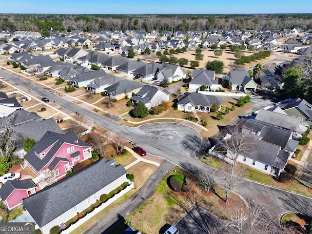 birds eye view of property with a residential view