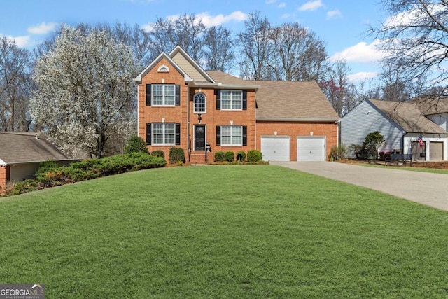 colonial home featuring a front yard, concrete driveway, brick siding, and an attached garage