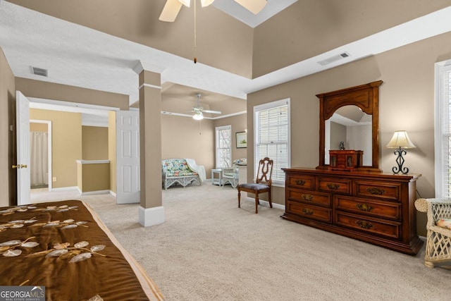 bedroom with light carpet, visible vents, ceiling fan, and baseboards