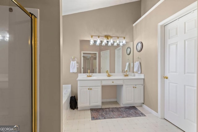 full bath featuring a shower stall, tile patterned floors, double vanity, a bath, and a sink