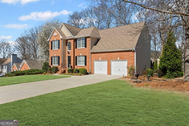 colonial inspired home featuring brick siding, an attached garage, concrete driveway, and a front yard