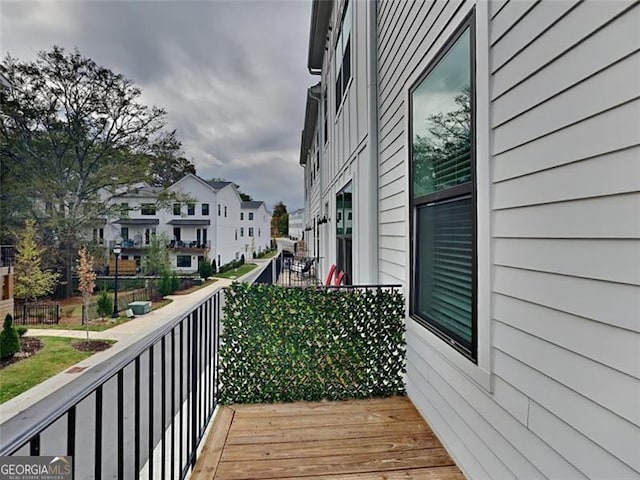 wooden terrace with a residential view