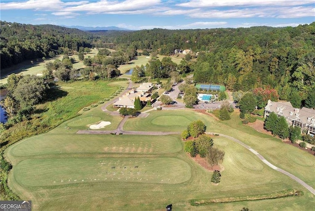 aerial view featuring a wooded view