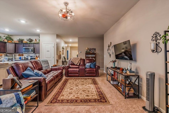 living room featuring light carpet, recessed lighting, and baseboards