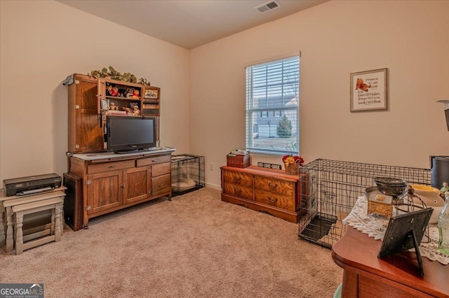 sitting room featuring light carpet and visible vents