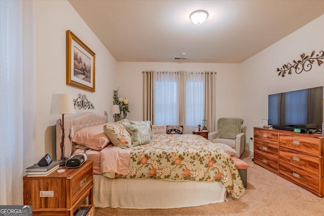 carpeted bedroom with visible vents