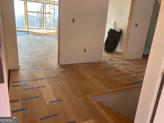 hall with wood finished floors