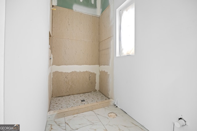 bathroom with marble finish floor