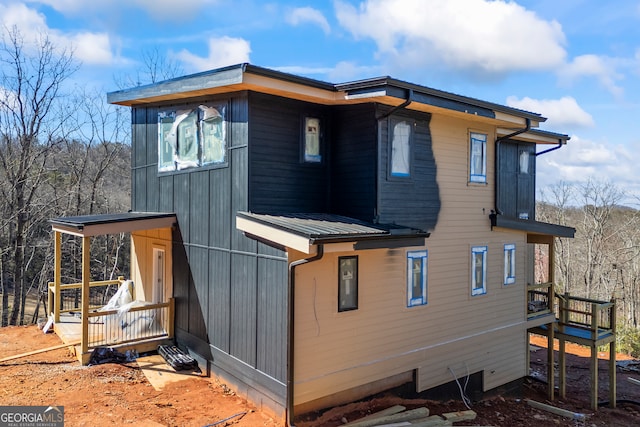 exterior space featuring metal roof