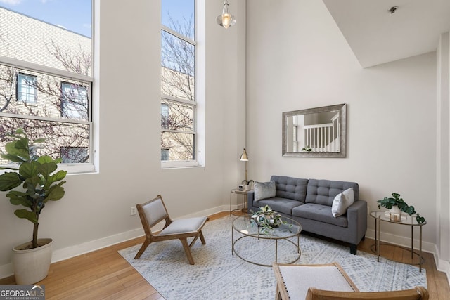 living room featuring baseboards and wood finished floors