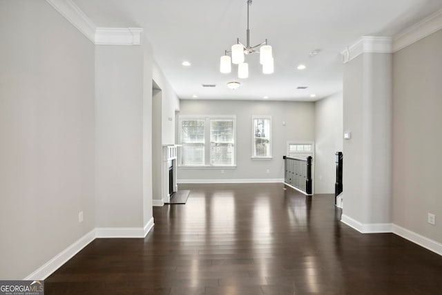 unfurnished dining area with a chandelier, recessed lighting, baseboards, and wood finished floors