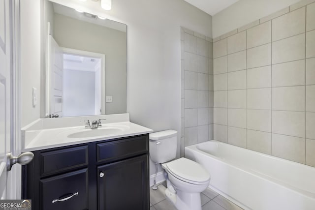 bathroom featuring vanity, toilet, and tile patterned flooring