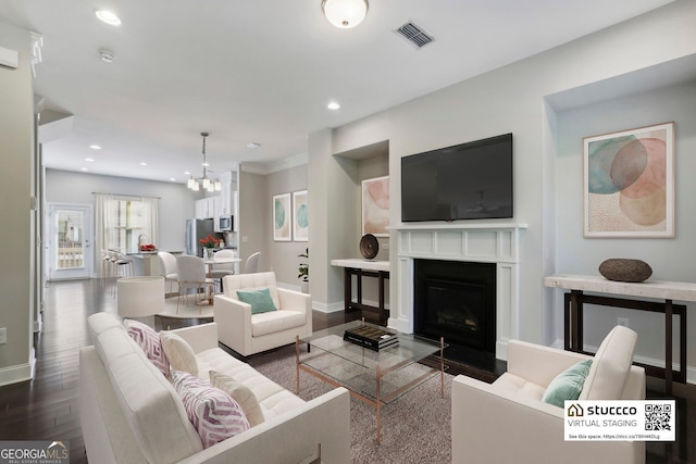 living area with recessed lighting, visible vents, baseboards, and dark wood-style floors