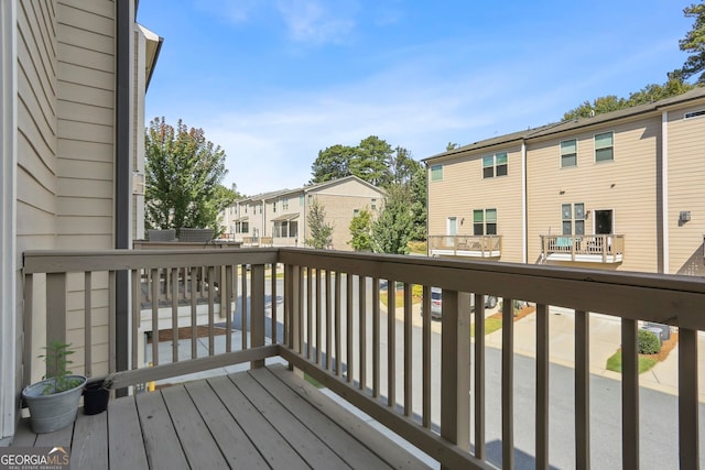 wooden terrace with a residential view