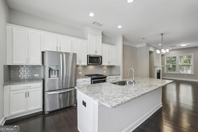 kitchen featuring white cabinets, dark wood-style flooring, appliances with stainless steel finishes, and a sink