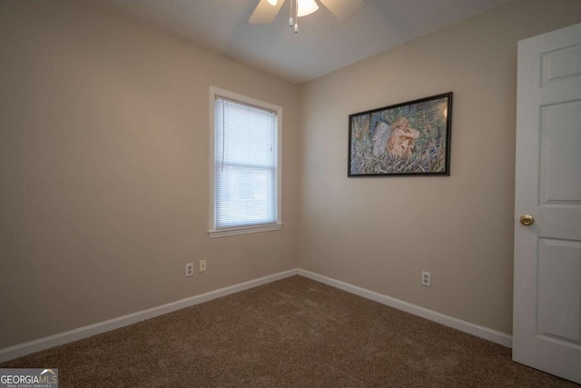 carpeted empty room with baseboards and ceiling fan