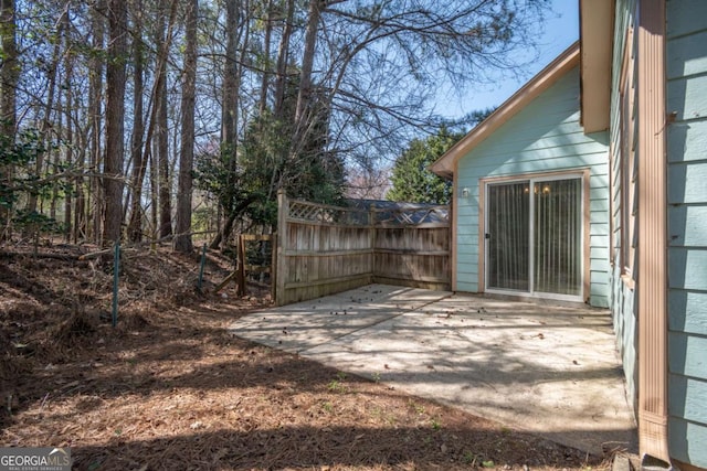 view of yard featuring a patio and fence