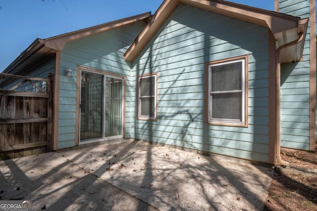 back of property featuring a patio