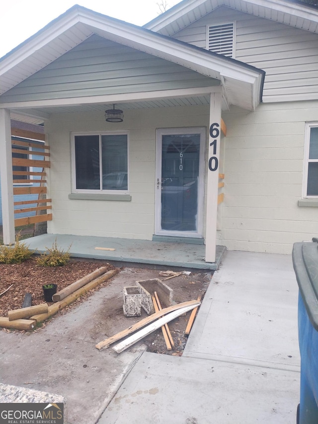 property entrance with concrete block siding