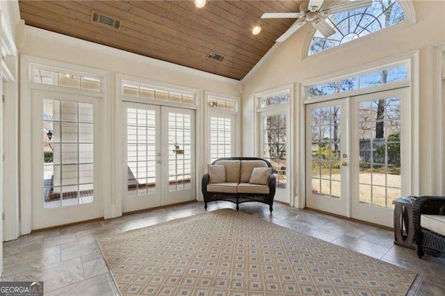 sunroom / solarium with a wealth of natural light, visible vents, french doors, and wooden ceiling