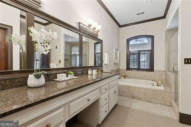 full bath with vanity, visible vents, ornamental molding, a shower stall, and a garden tub