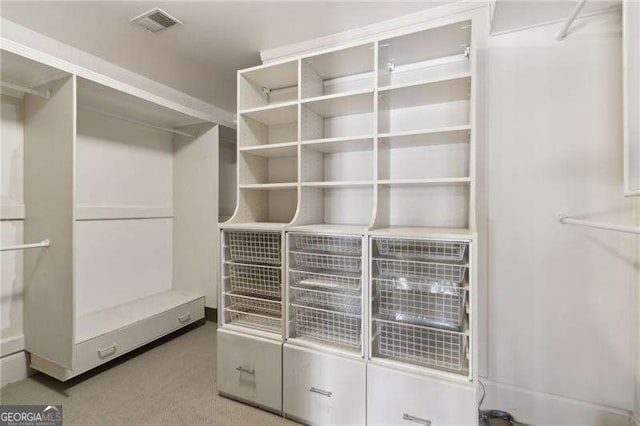 walk in closet with carpet and visible vents