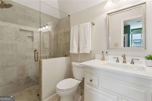 full bath featuring a shower stall, toilet, and vanity