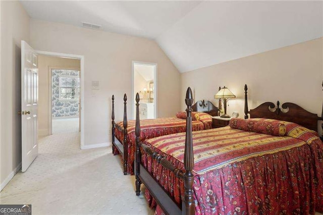 bedroom featuring visible vents, baseboards, light colored carpet, and vaulted ceiling