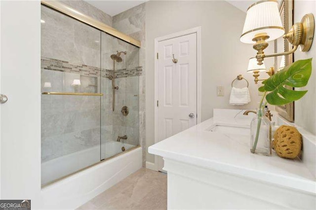 full bath with shower / bath combination with glass door and vanity