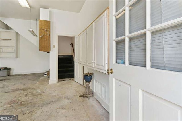 interior space featuring unfinished concrete floors