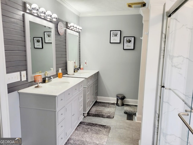 bathroom featuring visible vents, ornamental molding, a marble finish shower, baseboards, and vanity