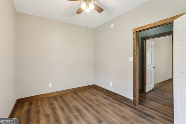 unfurnished room with baseboards, ceiling fan, and wood finished floors