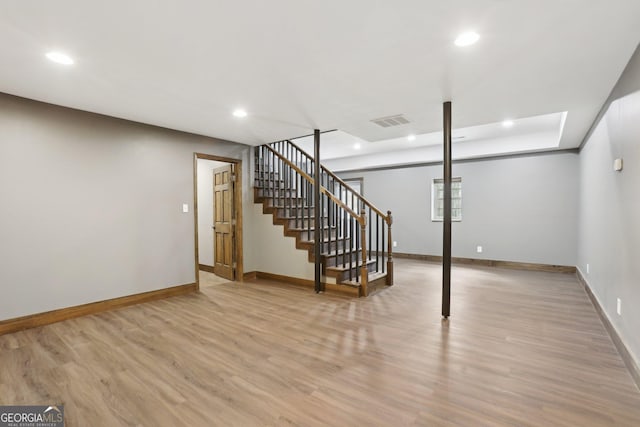 basement with recessed lighting, visible vents, baseboards, and light wood finished floors