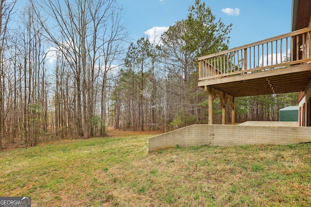 view of yard with a wooden deck