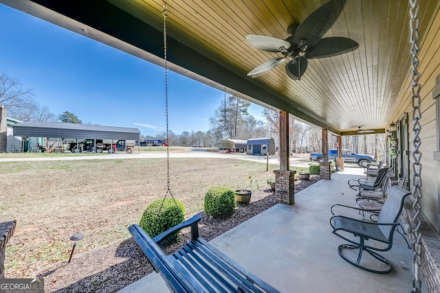 view of patio featuring ceiling fan