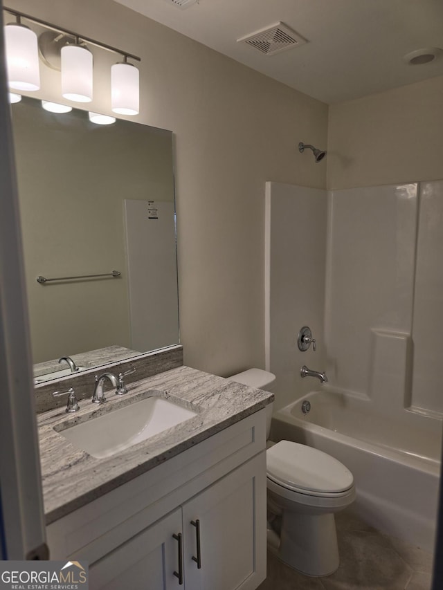 full bathroom featuring visible vents, toilet, vanity, and bathtub / shower combination