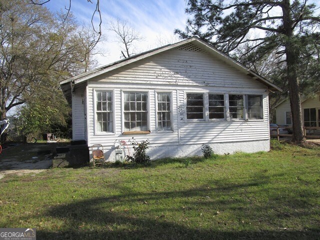 view of home's exterior featuring a yard