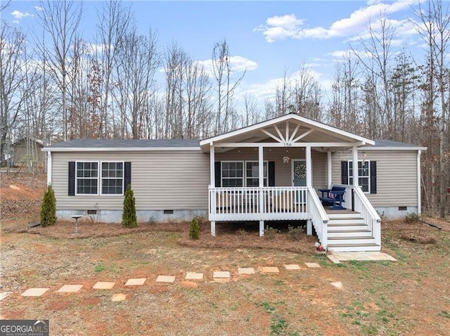 manufactured / mobile home with crawl space and a porch